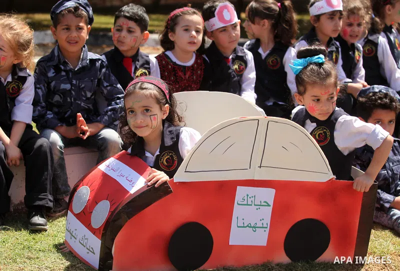 Palestinian children take part during a day where the traffic police have increased presence in the streets to raise traffic awareness in Gaza City on May 4, 2016. Photo by Ashraf Amra