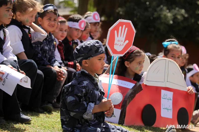 Palestinian children take part during a day where the traffic police have increased presence in the streets to raise traffic awareness in Gaza City on May 4, 2016. Photo by Ashraf Amra