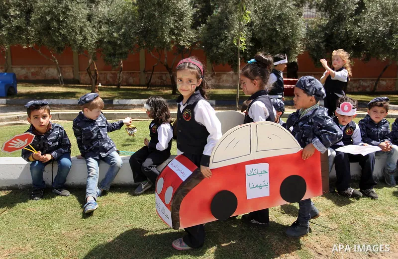 Palestinian children take part during a day where the traffic police have increased presence in the streets to raise traffic awareness in Gaza City on May 4, 2016. Photo by Ashraf Amra