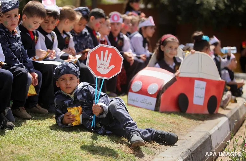 Palestinian children take part during a day where the traffic police have increased presence in the streets to raise traffic awareness in Gaza City on May 4, 2016. Photo by Ashraf Amra