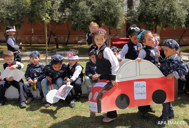 Palestinian children take part during a day where the traffic police have increased presence in the streets to raise traffic awareness in Gaza City on May 4, 2016. Photo by Ashraf Amra