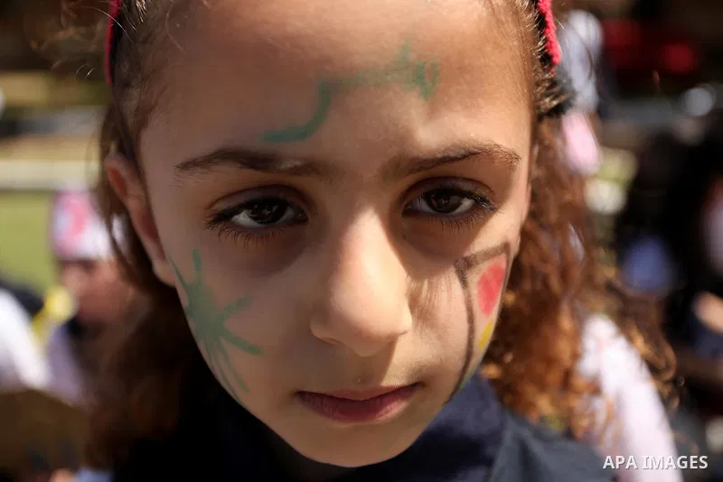 Palestinian children take part during a day where the traffic police have increased presence in the streets to raise traffic awareness in Gaza City on May 4, 2016. Photo by Ashraf Amra