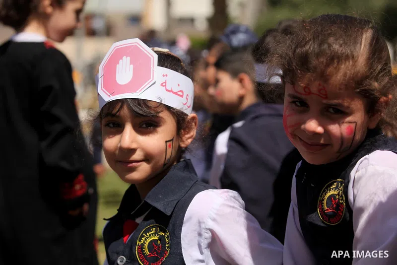 Palestinian children take part during a day where the traffic police have increased presence in the streets to raise traffic awareness in Gaza City on May 4, 2016. Photo by Ashraf Amra