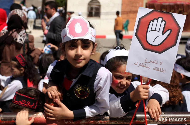 Palestinian children take part during a day where the traffic police have increased presence in the streets to raise traffic awareness in Gaza City on May 4, 2016. Photo by Ashraf Amra