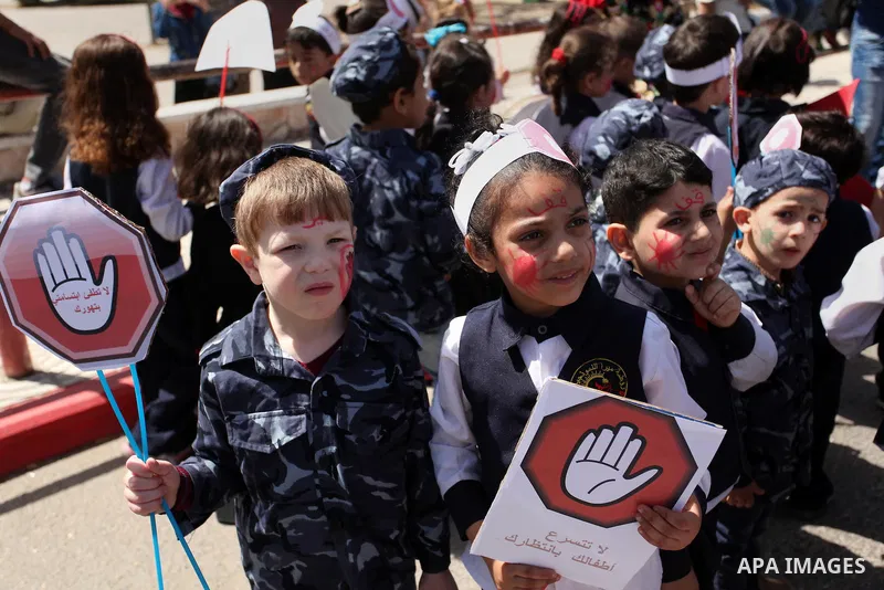 Palestinian children take part during a day where the traffic police have increased presence in the streets to raise traffic awareness in Gaza City on May 4, 2016. Photo by Ashraf Amra