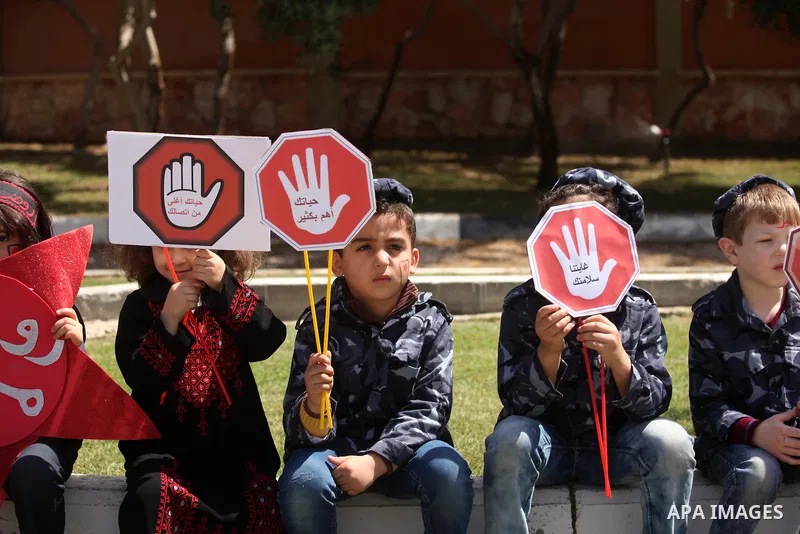 Palestinian children take part during a day where the traffic police have increased presence in the streets to raise traffic awareness in Gaza City on May 4, 2016. Photo by Ashraf Amra