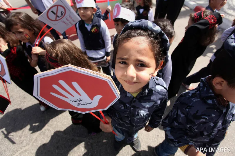 Palestinian children take part during a day where the traffic police have increased presence in the streets to raise traffic awareness in Gaza City on May 4, 2016. Photo by Ashraf Amra