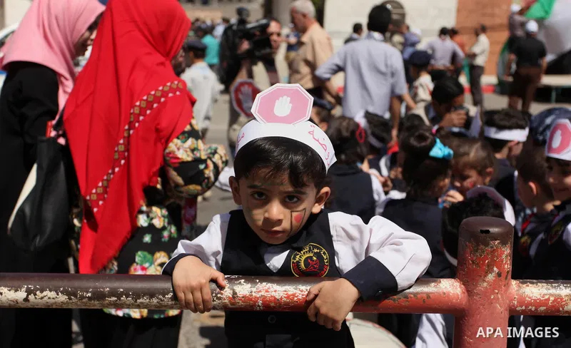 Palestinian children take part during a day where the traffic police have increased presence in the streets to raise traffic awareness in Gaza City on May 4, 2016. Photo by Ashraf Amra