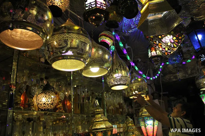 A Palestinian vendor displays goods at market in Jerusalem's old city on May 4, 2016. Photo by Mahfouz Abu Turk
