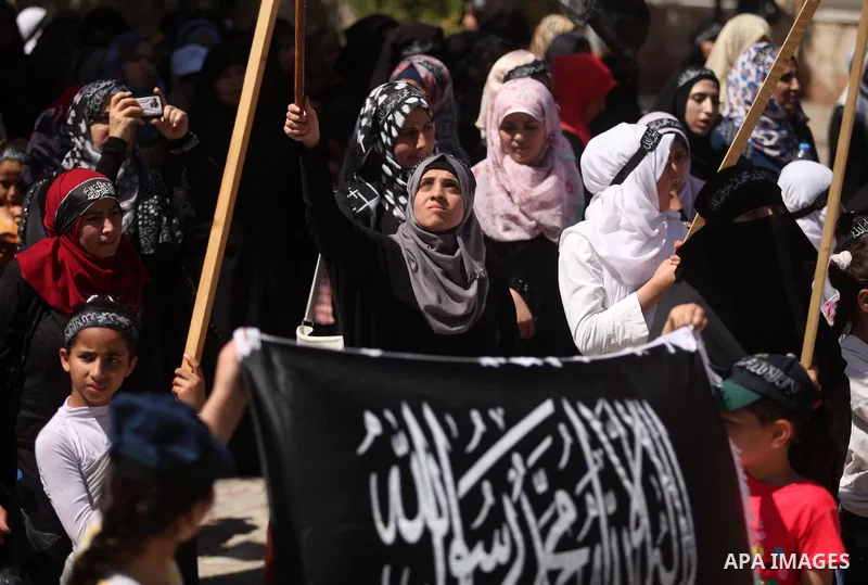 Palestinian supporters of the Islamist party Hizb Ut-Tahrir take part in a rally to mark the 95th anniversary of the overthrow of the Islamic Caliphate, in Gaza city on May 5, 2016. Photo by Ashraf Amra