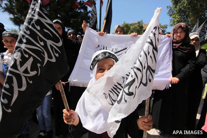 Palestinian supporters of the Islamist party Hizb Ut-Tahrir take part in a rally to mark the 95th anniversary of the overthrow of the Islamic Caliphate, in Gaza city on May 5, 2016. Photo by Ashraf Amra