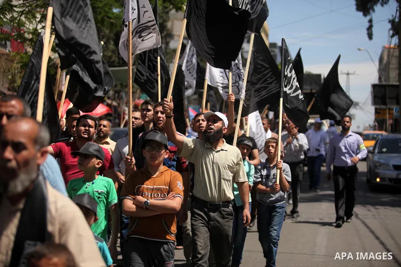 Palestinian supporters of the Islamist party Hizb Ut-Tahrir take part in a rally to mark the 95th anniversary of the overthrow of the Islamic Caliphate, in Gaza city on May 5, 2016. Photo by Ashraf Amra