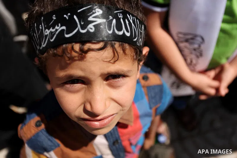 Palestinian supporters of the Islamist party Hizb Ut-Tahrir take part in a rally to mark the 95th anniversary of the overthrow of the Islamic Caliphate, in Gaza city on May 5, 2016. Photo by Ashraf Amra