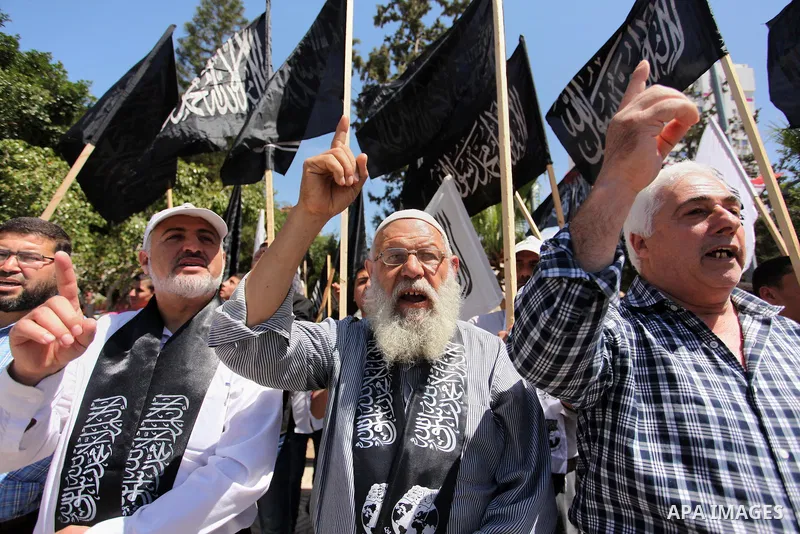 Palestinian supporters of the Islamist party Hizb Ut-Tahrir take part in a rally to mark the 95th anniversary of the overthrow of the Islamic Caliphate, in Gaza city on May 5, 2016. Photo by Ashraf Amra