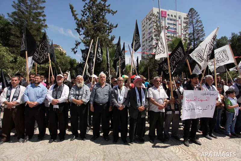 Palestinian supporters of the Islamist party Hizb Ut-Tahrir take part in a rally to mark the 95th anniversary of the overthrow of the Islamic Caliphate, in Gaza city on May 5, 2016. Photo by Ashraf Amra