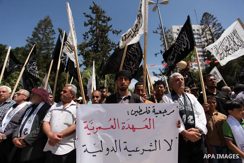 Palestinian supporters of the Islamist party Hizb Ut-Tahrir take part in a rally to mark the 95th anniversary of the overthrow of the Islamic Caliphate, in Gaza city on May 5, 2016. Photo by Ashraf Amra
