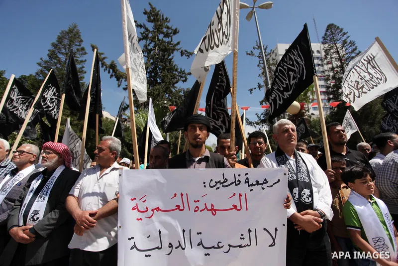 Palestinian supporters of the Islamist party Hizb Ut-Tahrir take part in a rally to mark the 95th anniversary of the overthrow of the Islamic Caliphate, in Gaza city on May 5, 2016. Photo by Ashraf Amra