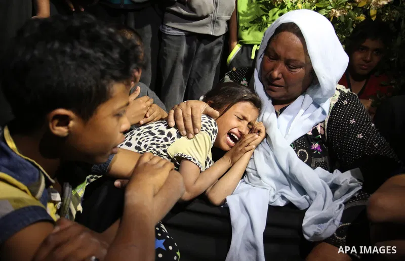 Relatives of Zine al-Umur, 55, who lost her life after Israeli warplanes bombed around Gaza's southern, during a funeral ceremony in east of the Rafah city, Gaza on May 5, 2016.. Photo by Ramadan Elagha