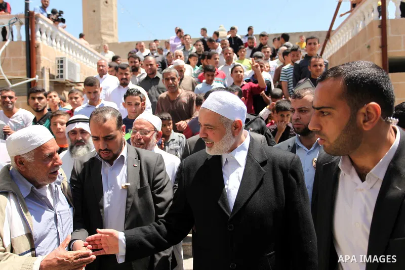 Palestinian Islamist movement Hamas' chief, Ismail Haniya leaves a mosque after giving a speech during the Friday prayer on May 6, 2016 in Deir al-Balah, in the center of the Gaza Strip. Photo by Ashraf Amra