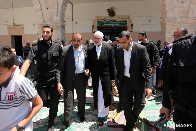 Palestinian Islamist movement Hamas' chief, Ismail Haniya leaves a mosque after giving a speech during the Friday prayer on May 6, 2016 in Deir al-Balah, in the center of the Gaza Strip. Photo by Ashraf Amra