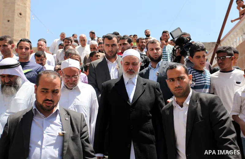 Palestinian Islamist movement Hamas' chief, Ismail Haniya leaves a mosque after giving a speech during the Friday prayer on May 6, 2016 in Deir al-Balah, in the center of the Gaza Strip. Photo by Ashraf Amra