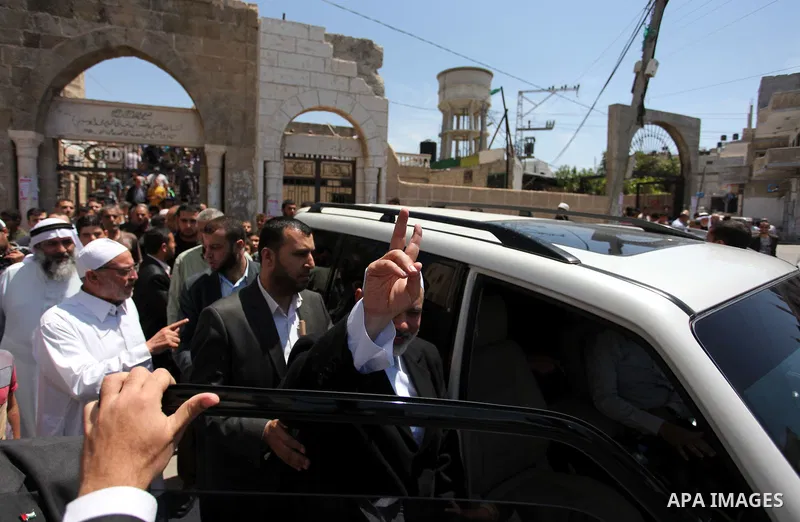 Palestinian Islamist movement Hamas' chief, Ismail Haniya leaves a mosque after giving a speech during the Friday prayer on May 6, 2016 in Deir al-Balah, in the center of the Gaza Strip. Photo by Ashraf Amra