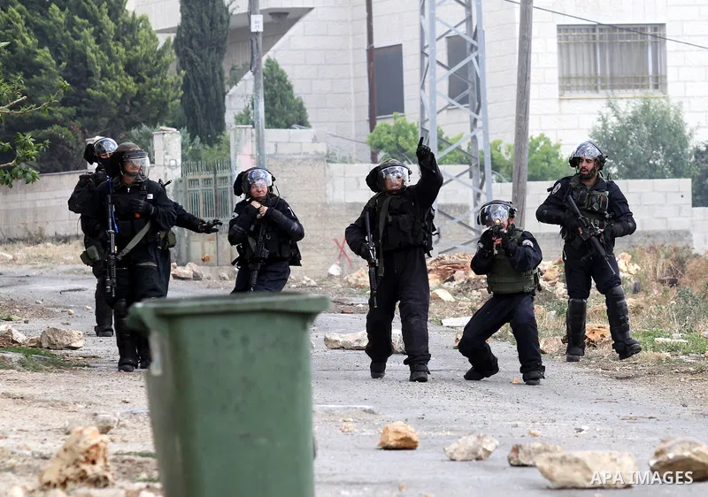 Israeli security forces aim at Palestinian protesters during clashes following a demonstration against the expropriation of Palestinian land by Israel on May 06, 2016 in the village of Kfar Qaddum, near Nablus, in the oc...