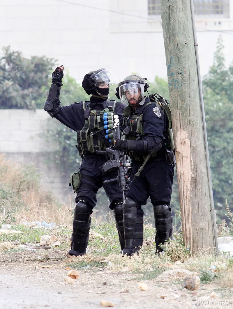 Israeli security forces aim at Palestinian protesters during clashes following a demonstration against the expropriation of Palestinian land by Israel on May 06, 2016 in the village of Kfar Qaddum, near Nablus, in the oc...