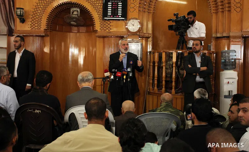 Palestinian Islamist movement Hamas' chief, Ismail Haniya gives a speech at a mosque during the funeral of three children from the al-Hindi family, who died in a fire caused by a candle at the family home at the al-Shati...