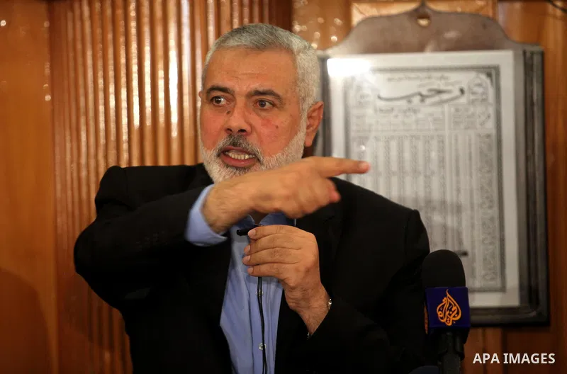 Palestinian Islamist movement Hamas' chief, Ismail Haniya gives a speech at a mosque during the funeral of three children from the al-Hindi family, who died in a fire caused by a candle at the family home at the al-Shati...