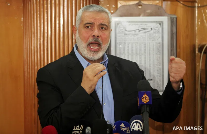 Palestinian Islamist movement Hamas' chief, Ismail Haniya gives a speech at a mosque during the funeral of three children from the al-Hindi family, who died in a fire caused by a candle at the family home at the al-Shati...
