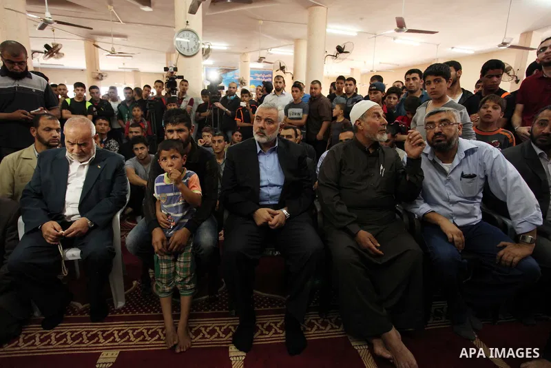 Palestinian Islamist movement Hamas' chief, Ismail Haniya attends the funeral of three children from the al-Hindi family, who died in a fire caused by a candle at the family home at the al-Shati refugee camp in Gaza City...