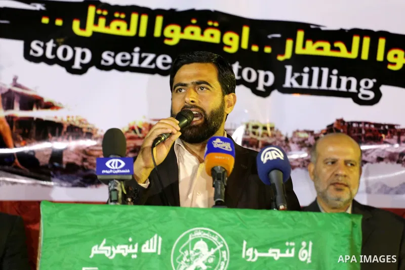 Mushir Al Masri, a Hamas MP and media spokesman speaks during a protest demanding for end the siege on Gaza and against the killing of three boys from the al-Hindi family, who died in a fire caused by a candle at the fam...