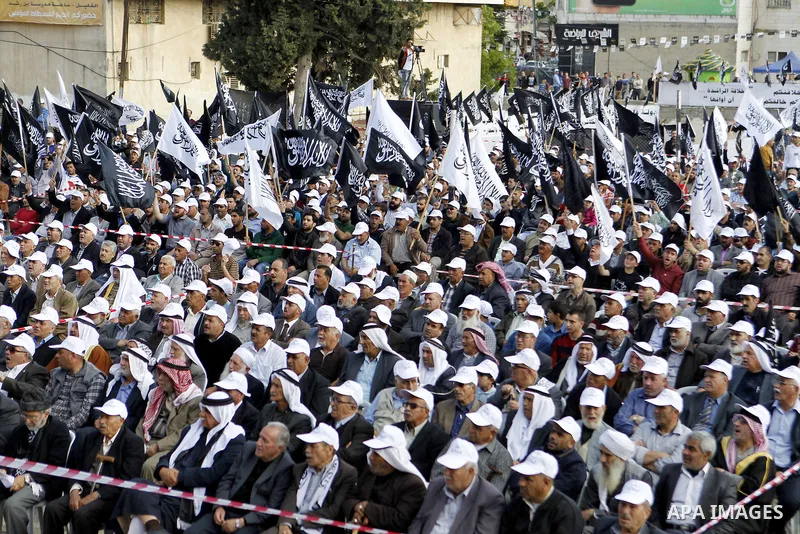 Palestinian supporters of the Islamist party Hizb Ut-Tahrir take part in a rally to mark the 95th anniversary of the overthrow of the Islamic Caliphate, in the West Bank city of Hebron on May 7, 2016. Photo by Wisam Hash...