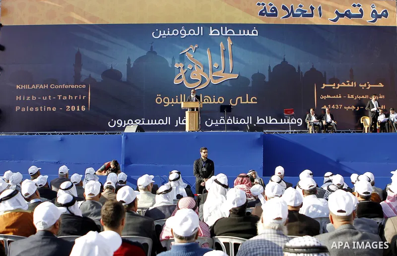 Palestinian supporters of the Islamist party Hizb Ut-Tahrir take part in a rally to mark the 95th anniversary of the overthrow of the Islamic Caliphate, in the West Bank city of Hebron on May 7, 2016. Photo by Wisam Hash...