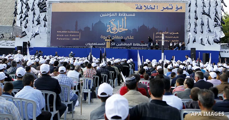 Palestinian supporters of the Islamist party Hizb Ut-Tahrir take part in a rally to mark the 95th anniversary of the overthrow of the Islamic Caliphate, in the West Bank city of Hebron on May 7, 2016. Photo by Wisam Hash...