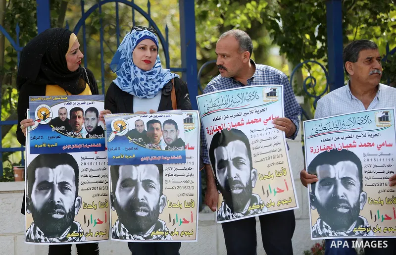 Palestinians take part in a protest demanding release the prisoners in Israeli jails, in the West Bank city of al-Bireh, on May 9, 2016. Photo by Shadi Hatem