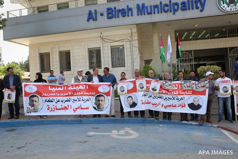 Palestinians take part in a protest demanding release the prisoners in Israeli jails, in the West Bank city of al-Bireh, on May 9, 2016. Photo by Shadi Hatem