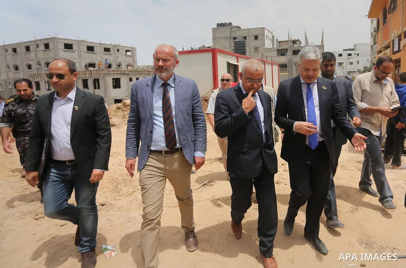 Belgian Foreign Minister Didier Reynders visits the eastern Gaza City Shujaiya neighbourhood which was destroyed during the 50-day war between Israel and Hamas militants in the summer of 2014, during an official visit in...