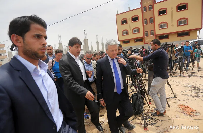 Belgian Foreign Minister Didier Reynders visits the eastern Gaza City Shujaiya neighbourhood which was destroyed during the 50-day war between Israel and Hamas militants in the summer of 2014, during an official visit in...