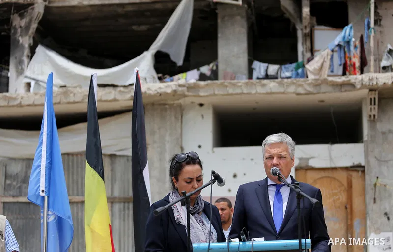 Belgian Foreign Minister Didier Reynders delivers a speech in the eastern Gaza City Shujaiya neighbourhood, which was destroyed during the 50-day war between Israel and Hamas militants in the summer of 2014, during an of...