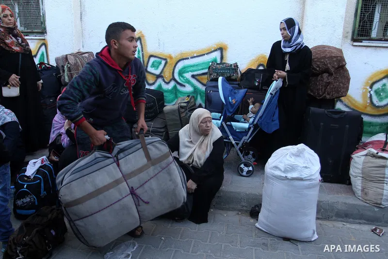 Palestinians wait at the Rafah border crossing with Egypt, in the southern Gaza Strip, after it was opened for two days by Egyptian authorities, on May 11, 2016. On May 2 Israeli Defence Minister Moshe Yaalon on Monday a...