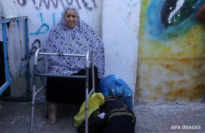 A Palestinian woman waits at the Rafah border crossing with Egypt, in the southern Gaza Strip, after it was opened for two days by Egyptian authorities, on May 11, 2016. On May 2 Israeli Defence Minister Moshe Yaalon on...