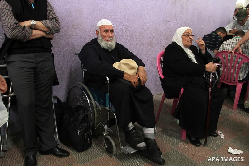 Palestinians wait at the Rafah border crossing with Egypt, in the southern Gaza Strip, after it was opened for two days by Egyptian authorities, on May 11, 2016. On May 2 Israeli Defence Minister Moshe Yaalon on Monday a...