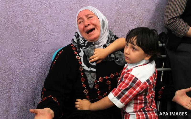 A Palestinian woman waits at the Rafah border crossing with Egypt, in the southern Gaza Strip, after it was opened for two days by Egyptian authorities, on May 11, 2016. On May 2 Israeli Defence Minister Moshe Yaalon on...
