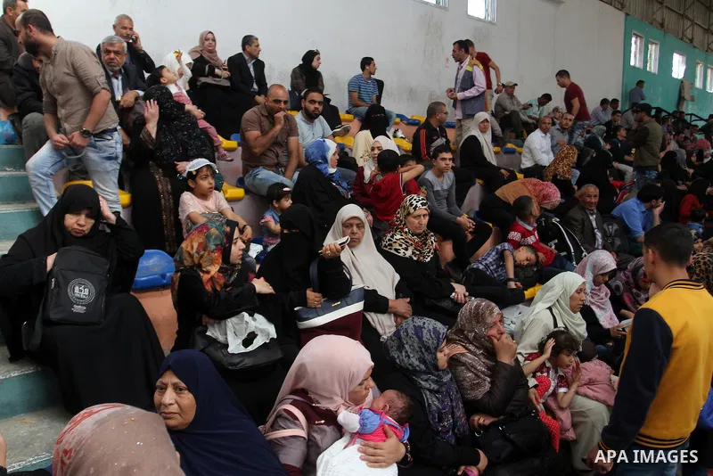 Palestinians wait at the Rafah border crossing with Egypt, in the southern Gaza Strip, after it was opened for two days by Egyptian authorities, on May 11, 2016. On May 2 Israeli Defence Minister Moshe Yaalon on Monday a...