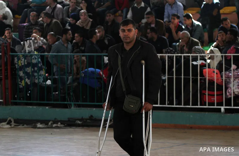 Palestinians wait at the Rafah border crossing with Egypt, in the southern Gaza Strip, after it was opened for two days by Egyptian authorities, on May 11, 2016. On May 2 Israeli Defence Minister Moshe Yaalon on Monday a...