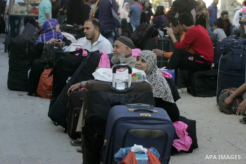 Palestinians wait at the Rafah border crossing with Egypt, in the southern Gaza Strip, after it was opened for two days by Egyptian authorities, on May 11, 2016. On May 2 Israeli Defence Minister Moshe Yaalon on Monday a...