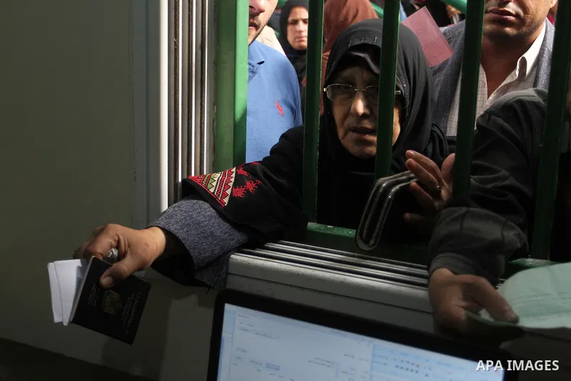 Palestinians wait at the Rafah border crossing with Egypt, in the southern Gaza Strip, after it was opened for two days by Egyptian authorities, on May 11, 2016. On May 2 Israeli Defence Minister Moshe Yaalon on Monday a...