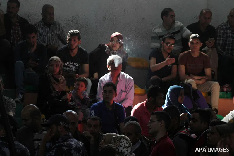 Palestinians wait at the Rafah border crossing with Egypt, in the southern Gaza Strip, after it was opened for two days by Egyptian authorities, on May 11, 2016. On May 2 Israeli Defence Minister Moshe Yaalon on Monday a...